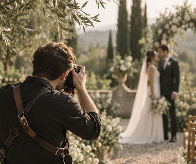 A photographer working at a wedding
